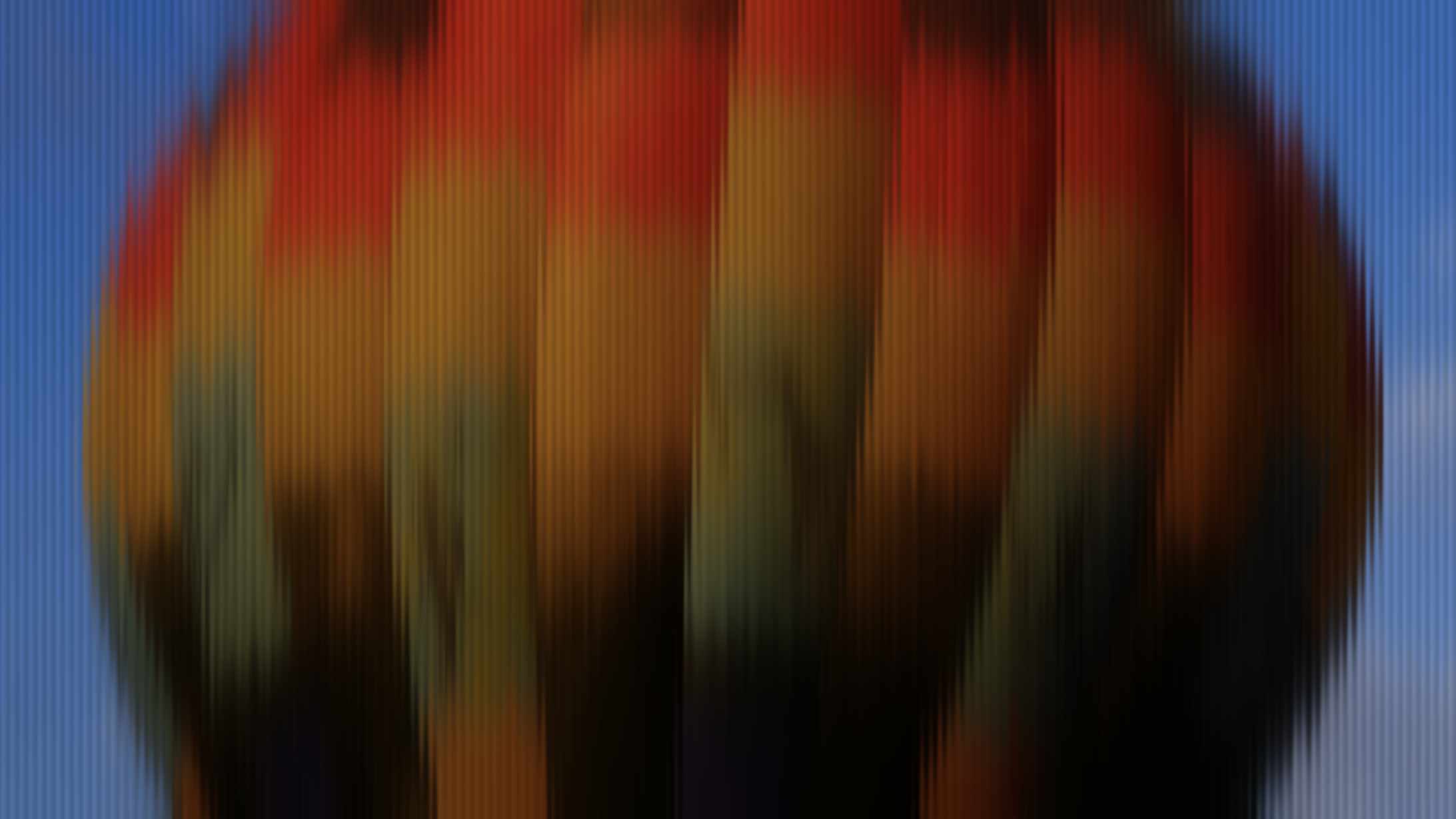 Washed abstract of a hot-air balloon canopy against blue sky